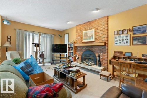 10511 74 Street, Edmonton, AB - Indoor Photo Showing Living Room With Fireplace