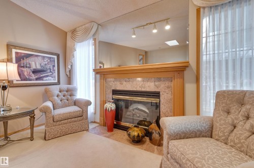 752 Wilkin Close, Edmonton, AB - Indoor Photo Showing Living Room With Fireplace