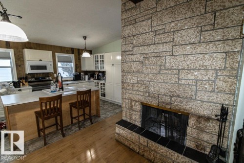 5006 51 St, Myrnam, AB - Indoor With Fireplace