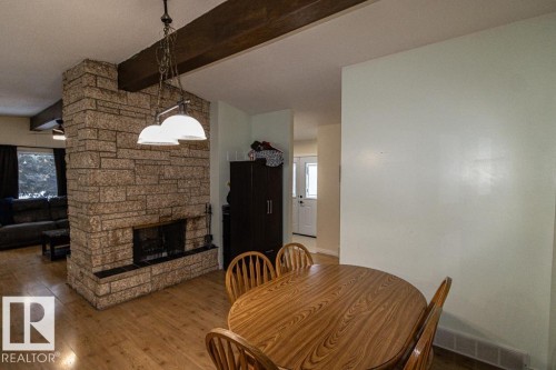 5006 51 St, Myrnam, AB - Indoor Photo Showing Dining Room With Fireplace