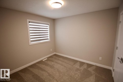Upper 9385 Cooper Bend, Edmonton, AB - Indoor Photo Showing Other Room