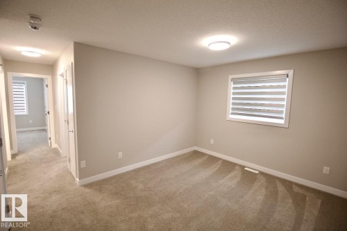 Upper 9385 Cooper Bend, Edmonton, AB - Indoor Photo Showing Other Room
