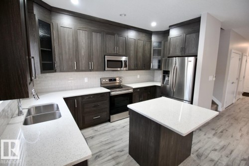 Upper 9385 Cooper Bend, Edmonton, AB - Indoor Photo Showing Kitchen With Double Sink With Upgraded Kitchen