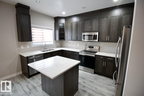 Upper 9385 Cooper Bend, Edmonton, AB - Indoor Photo Showing Kitchen With Double Sink With Upgraded Kitchen