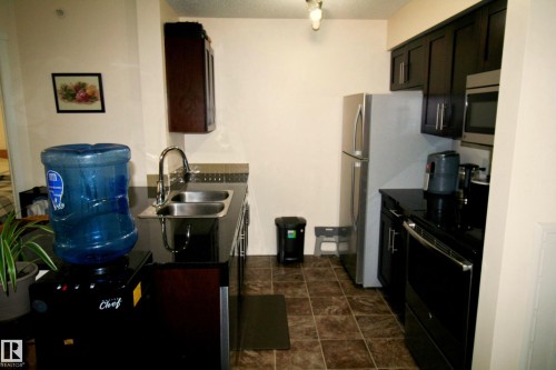 419 5816 Mullen Place, Edmonton, AB - Indoor Photo Showing Kitchen With Double Sink
