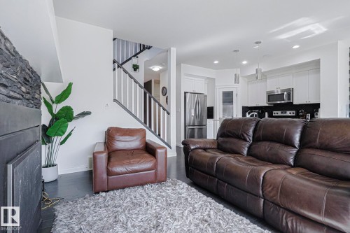 720 Charlesworth Way, Edmonton, AB - Indoor Photo Showing Living Room