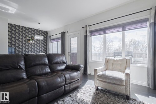 720 Charlesworth Way, Edmonton, AB - Indoor Photo Showing Living Room