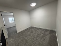 Empty room with dark carpet - 