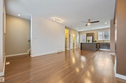 Unfurnished living room with recessed lighting, dark wood-type flooring, a textured ceiling, and ceiling fan - 