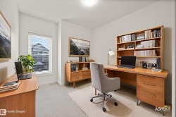 Office space with light carpet and baseboards - 