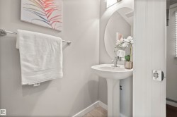 Bathroom with baseboards and tile patterned floors - 