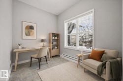 Office area with a baseboard heating unit and baseboards - 