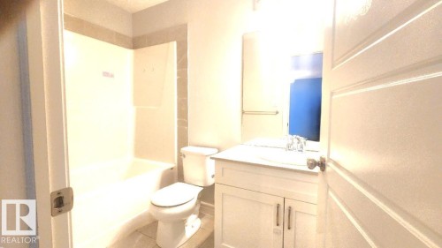Bathroom with vanity and washtub / shower combination - 4610 Kinsella Landing Sw, Edmonton, AB - Indoor Photo Showing Bathroom