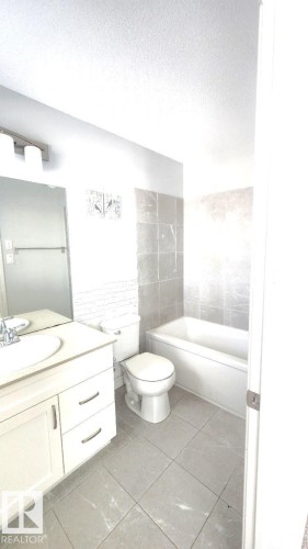 Bathroom featuring vanity and a textured ceiling - 4610 Kinsella Landing Sw, Edmonton, AB - Indoor Photo Showing Bathroom