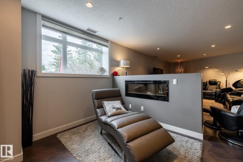 122 5151 Windermere Boulevard, Edmonton, AB - Indoor With Fireplace
