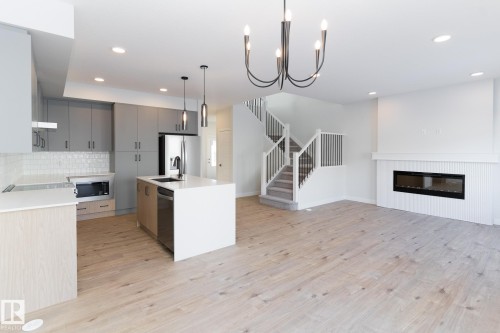 3038 Dixon Landing, Edmonton, AB - Indoor Photo Showing Kitchen With Fireplace With Upgraded Kitchen