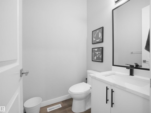Half bathroom featuring vanity and dark wood finished floors - 10911 159 Street, Edmonton, AB - Indoor Photo Showing Bathroom