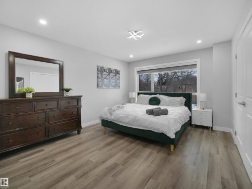 Bedroom featuring light wood-type flooring and recessed lighting - 10911 159 Street, Edmonton, AB - Indoor Photo Showing Bedroom
