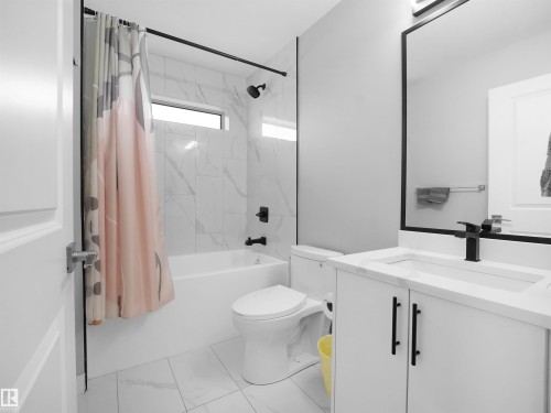 Full bathroom with shower / bath combination with curtain and vanity - 10911 159 Street, Edmonton, AB - Indoor Photo Showing Bathroom