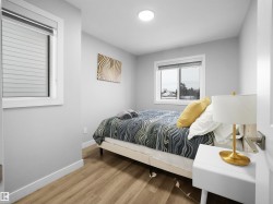 Bedroom with baseboards and light wood finished floors - 