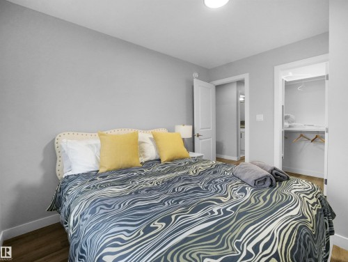 Bedroom with wood finished floors - 10911 159 Street, Edmonton, AB - Indoor Photo Showing Bedroom