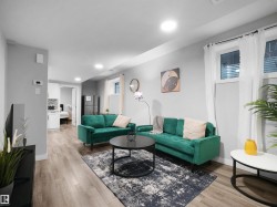 Living area featuring light wood-type flooring and recessed lighting - 