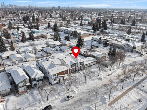 Snowy aerial view featuring a view of skyline - 10911 159 Street, Edmonton, AB - Outdoor With View