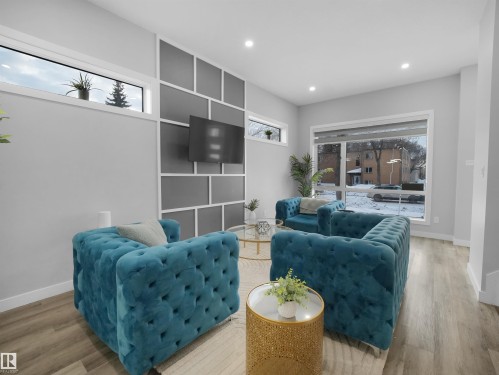 Living area featuring wood finished floors and recessed lighting - 10911 159 Street, Edmonton, AB - Indoor Photo Showing Living Room