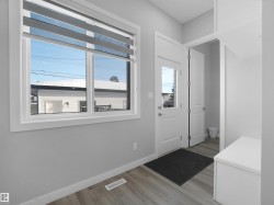 Doorway to outside featuring wood finished floors - 