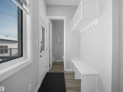 Mudroom with light wood-type flooring and baseboards - 