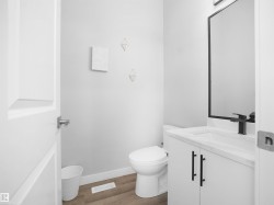 Bathroom with vanity and light wood-type flooring - 