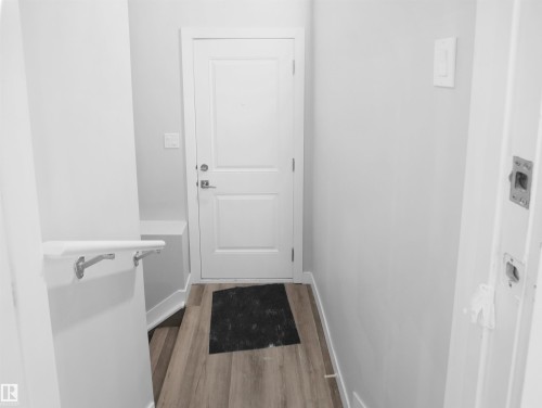 Entryway featuring wood finished floors and baseboards - 10913 159 Street, Edmonton, AB - Indoor Photo Showing Other Room