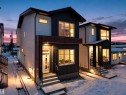 Snow covered property featuring entry steps and board and batten siding - 10913 159 Street, Edmonton, AB  - Outdoor 