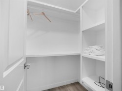 Spacious closet featuring light wood-type flooring - 