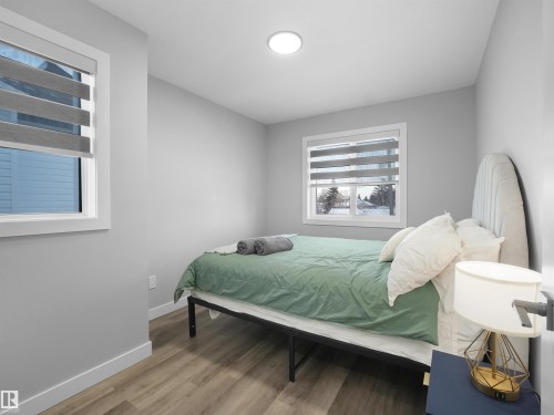 Bedroom featuring light wood-style flooring and baseboards - 10913 159 Street, Edmonton, AB - Indoor Photo Showing Bedroom