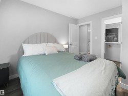 Bedroom with baseboards and wood finished floors - 