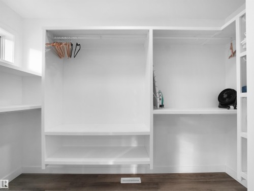 Spacious closet with dark wood-style flooring - 10913 159 Street, Edmonton, AB - Indoor With Storage