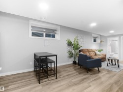 Legal basement suite Dining area with light wood-type flooring and recessed lighting - 