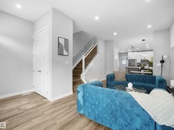 Living area featuring recessed lighting, light wood-type flooring, and stairway - 