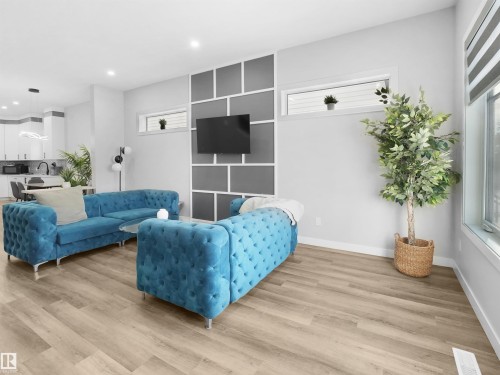 Living area with wood finished floors and recessed lighting - 10913 159 Street, Edmonton, AB - Indoor