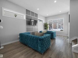 Living area featuring wood finished floors and recessed lighting - 