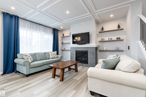 211 Caledon Crescent, Spruce Grove, AB - Indoor Photo Showing Living Room With Fireplace