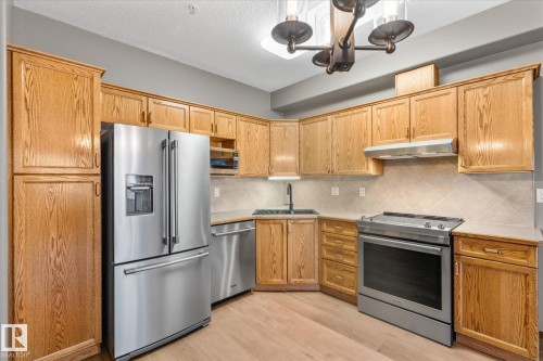 321 11260 153 Avenue, Edmonton, AB - Indoor Photo Showing Kitchen With Stainless Steel Kitchen With Double Sink
