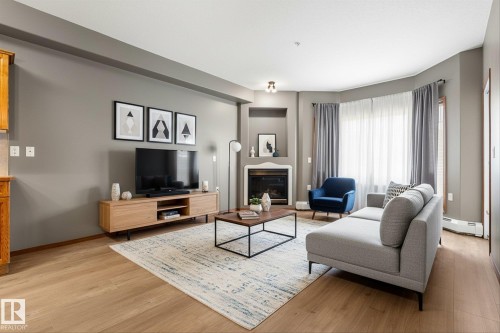 321 11260 153 Avenue, Edmonton, AB - Indoor Photo Showing Living Room With Fireplace