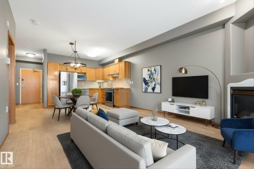 321 11260 153 Avenue, Edmonton, AB - Indoor Photo Showing Living Room With Fireplace