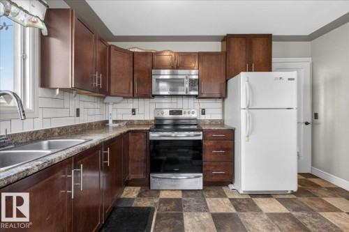 4427 32A Avenue, Edmonton, AB - Indoor Photo Showing Kitchen With Double Sink