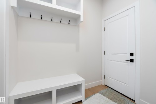 Mudroom with light wood-style flooring and baseboards - 38 Astoria Place, Devon, AB - Indoor Photo Showing Other Room