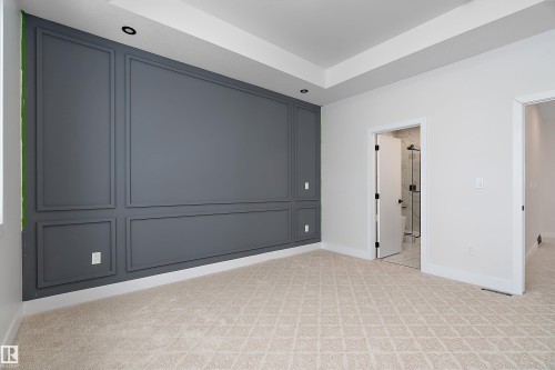 Unfurnished bedroom with light carpet and connected bathroom - 38 Astoria Place, Devon, AB - Indoor Photo Showing Other Room