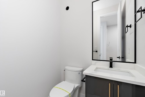 Half bath with toilet and vanity - 38 Astoria Place, Devon, AB - Indoor Photo Showing Bathroom