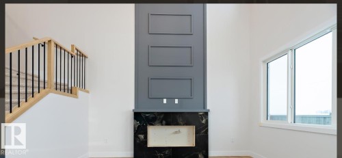 Foyer entrance featuring stairway and baseboards - 38 Astoria Place, Devon, AB - Indoor Photo Showing Other Room